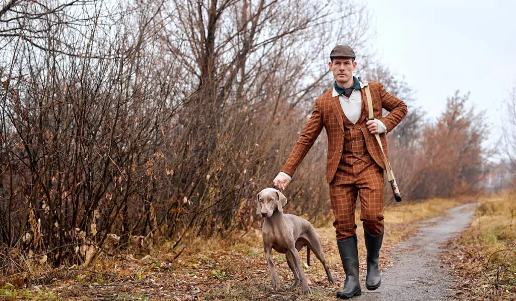 a well prepared hunter and his dog