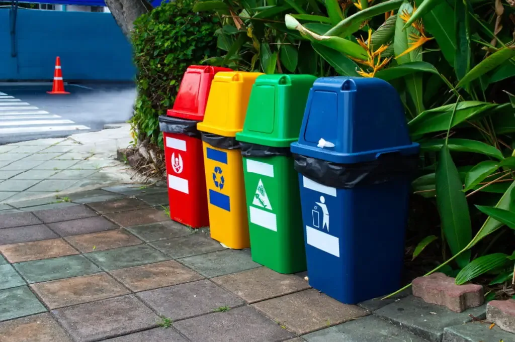 colored garbage bin at the side of the street