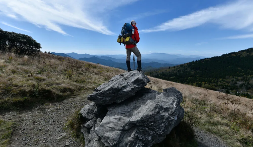 Backpacker in Red looking over the Appalachian trail
