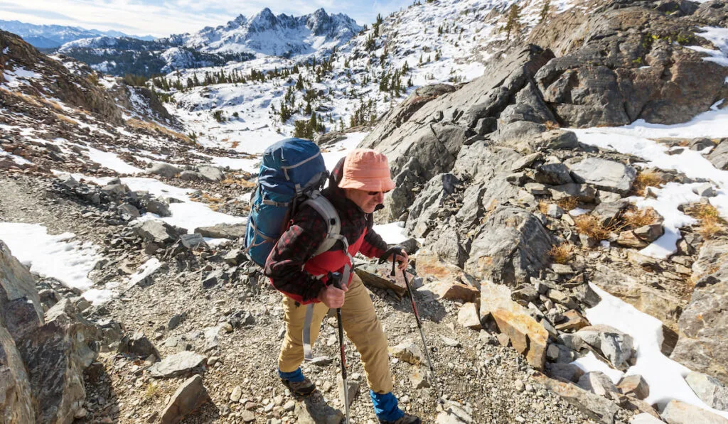 Backpacker in a hike in the summer m