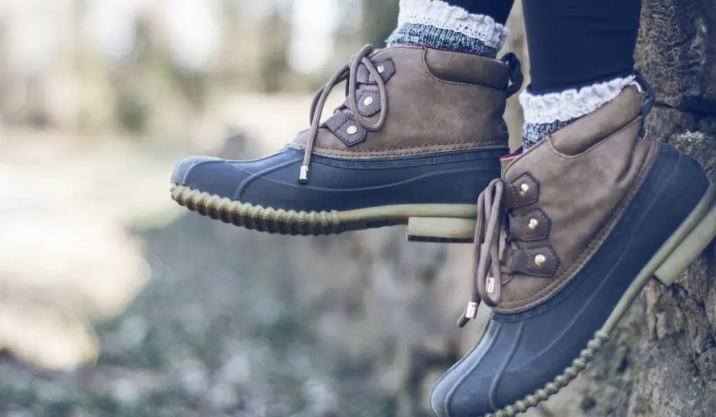 Close up of duck boots and frilly socks