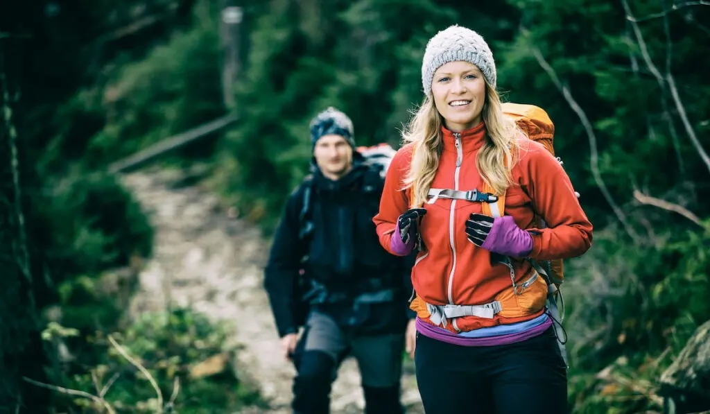 Couple hikers walking hiking