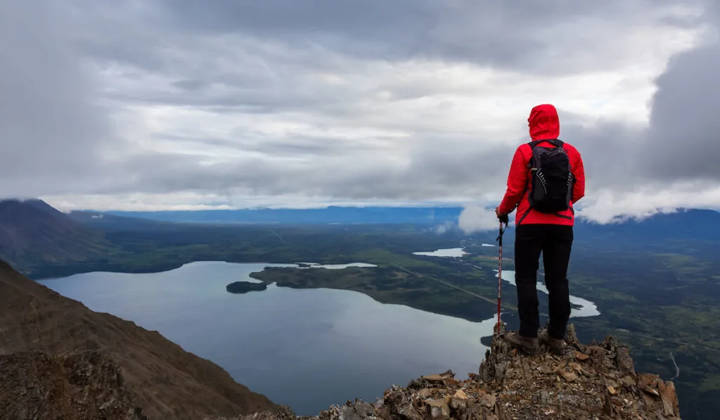 Girl Hiking on top of a Mountain Peak