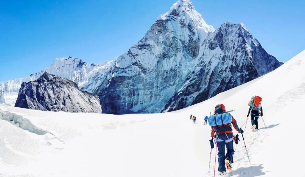 Group of climbers reaching the Everest summit in Nepal