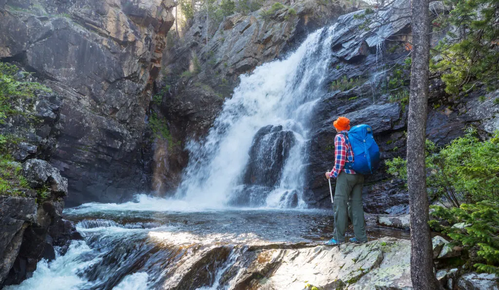 Hiker looking at a waterfall