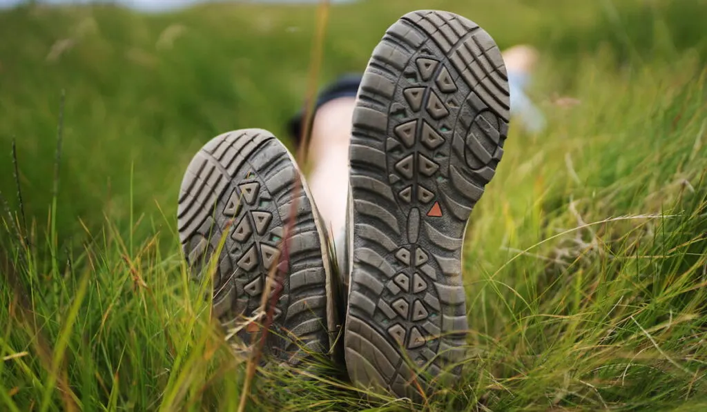Hiking boots in the grass