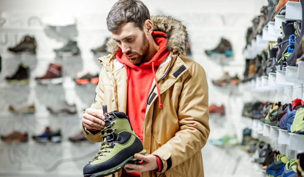 Man choosing shoes for hiking