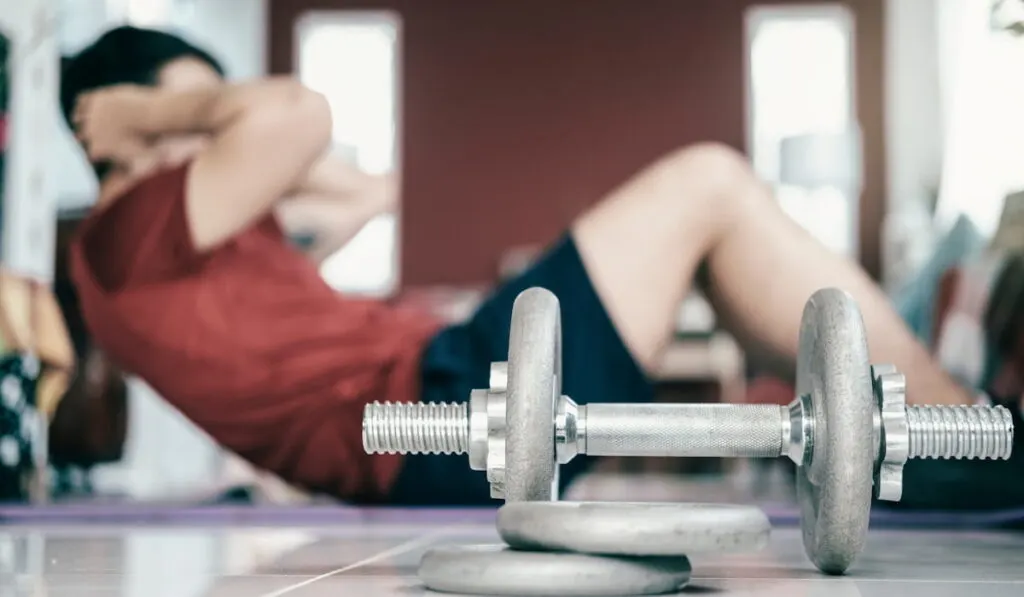 Man exercising at living room