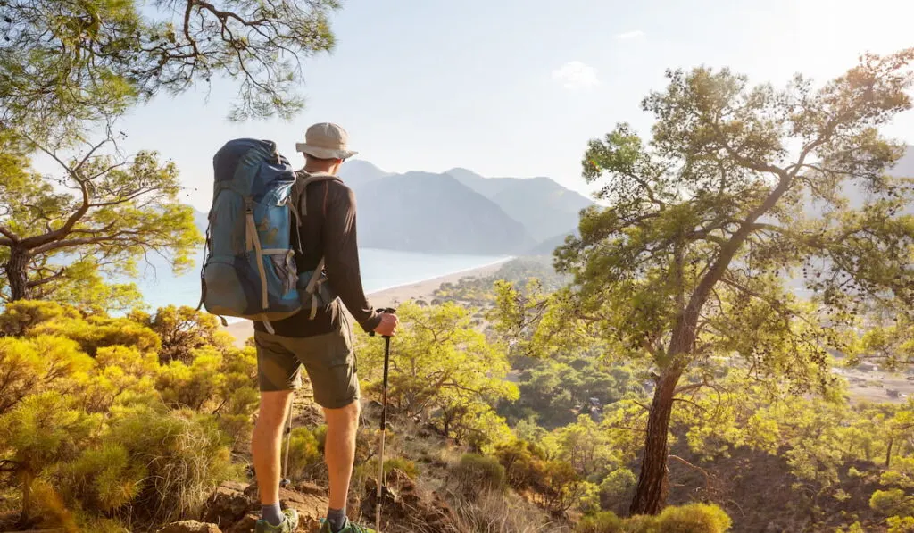 Man in a hike in the summer mountains.