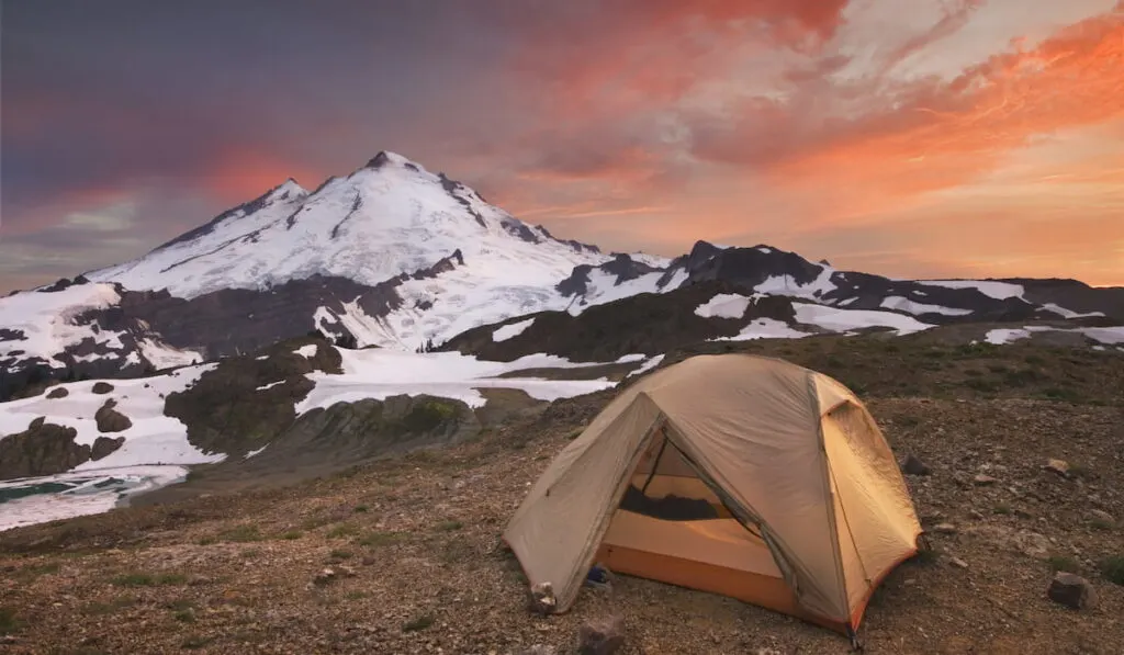 Tent at campsite in snowy mountain landscape