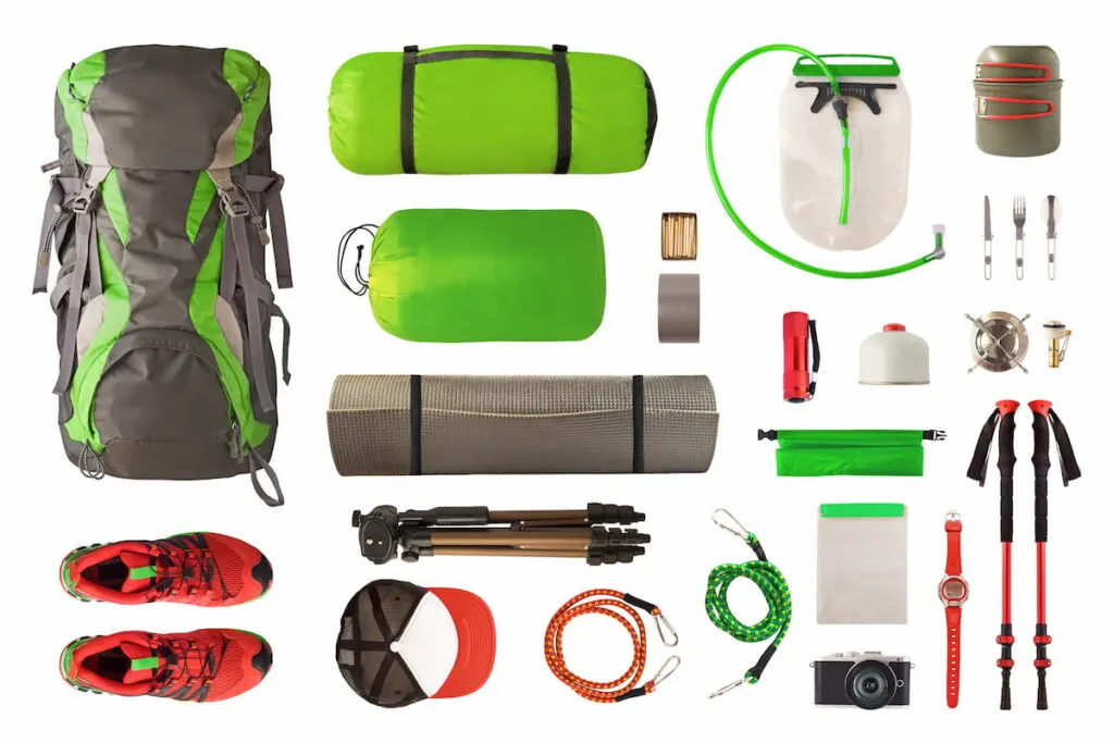 Top view of sport equipment and gear for trekking and camping