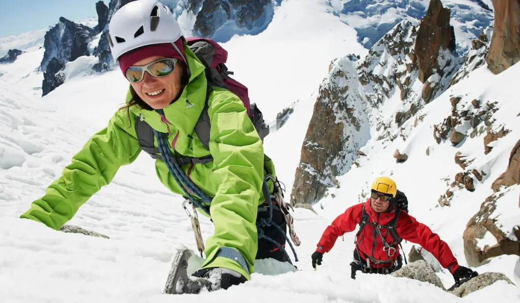 Two people mountain climbing