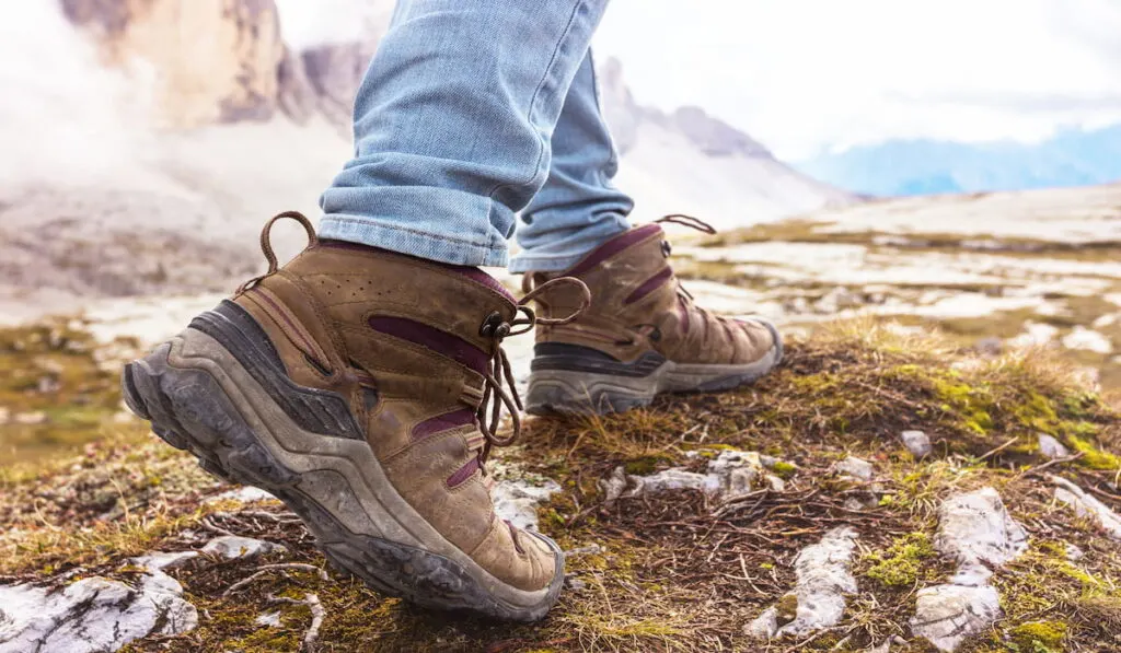 hiking boots close-up. tourist walking on the trail.