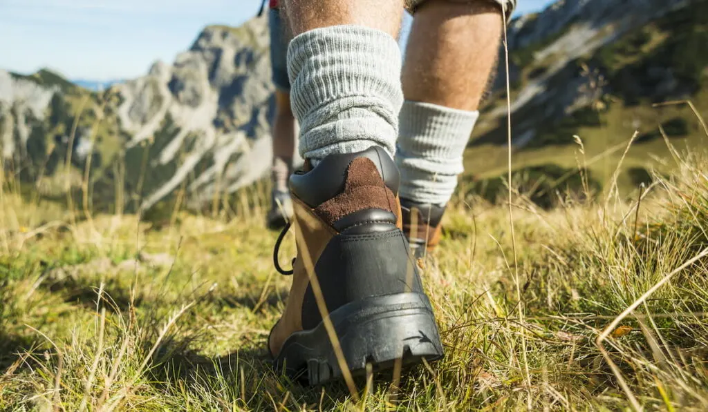 man wearing mid boots