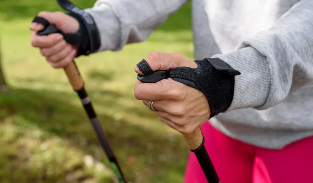 woman holding poles