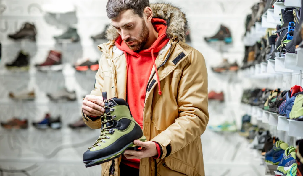 Man choosing shoes for hiking