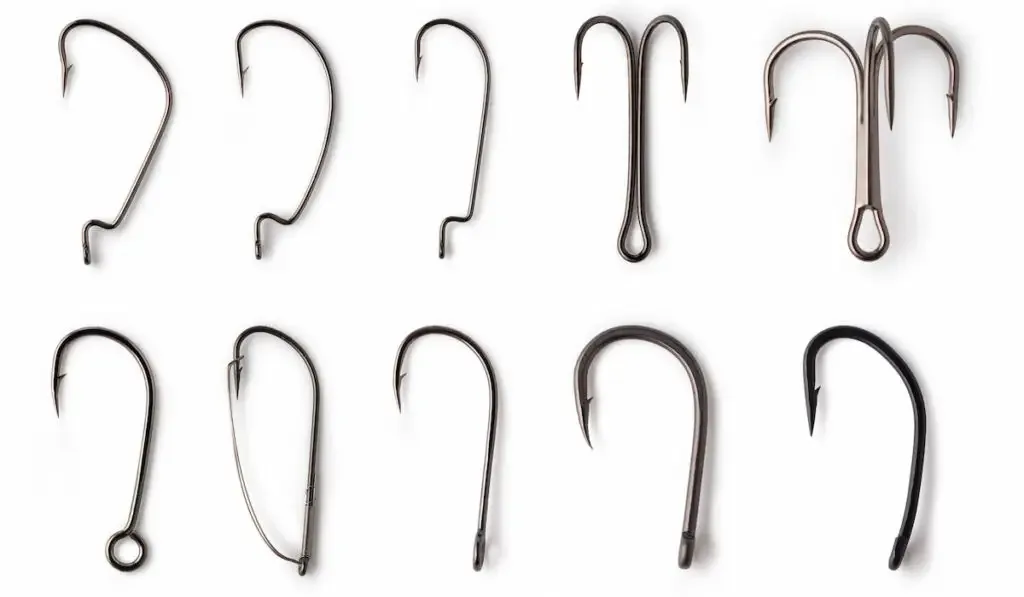 different fishing hooks on white background