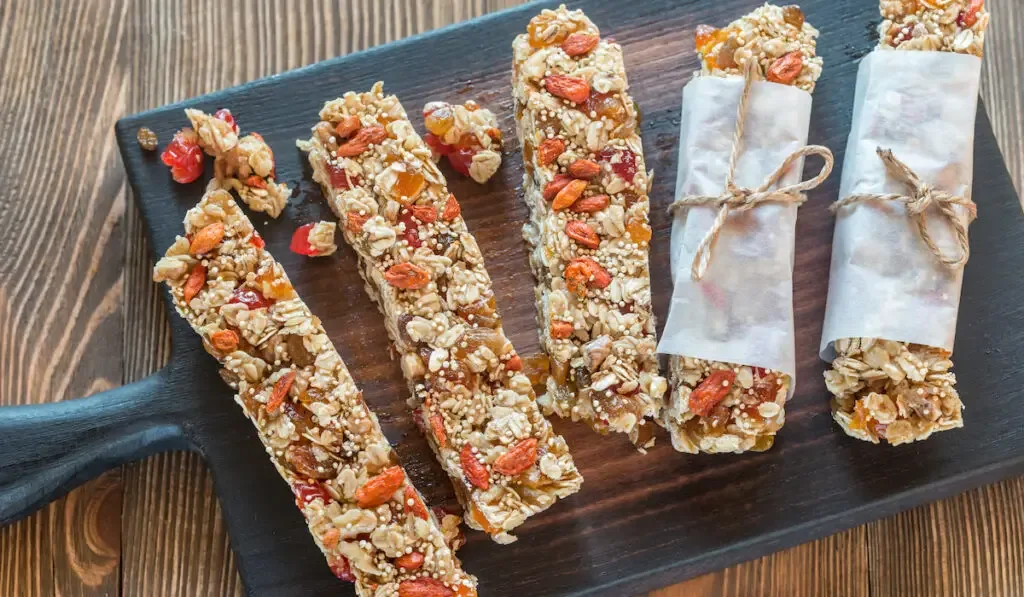Homemade granola bars on the wooden board

